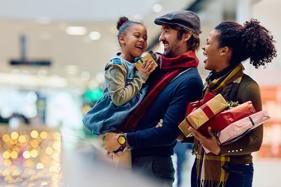 A happy family is shopping for the holidays at the mall in Fargo, ND.