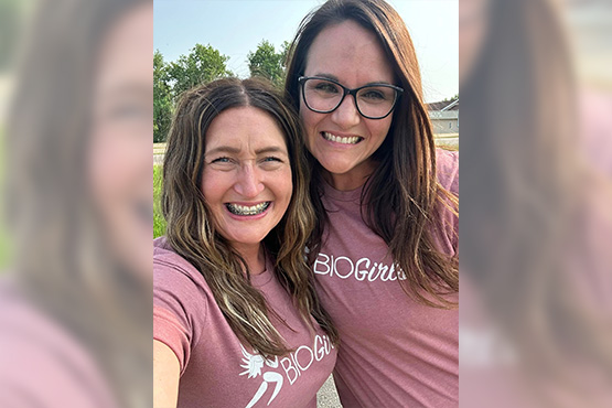 Gate City Bank’s Antoinette Sailor & BIO Girls-Devils Lake co-founder Margi Yanish pose for a photo wearing matching t-shirts