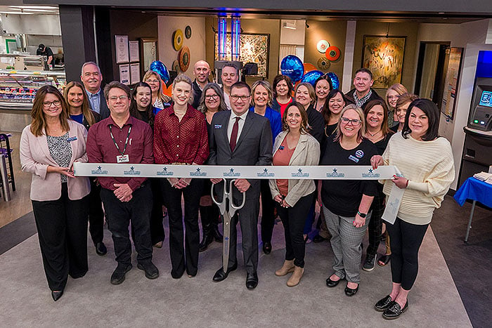 Gate City Bank team members and community partners pose for the camera during the Williston Cash Wise ribbon-cutting event